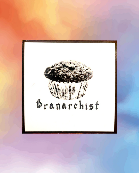 White square sticker with black border. Features image of a bran muffin with text below reading 'Branarchist'.